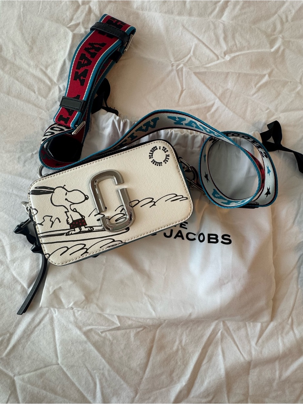 The Marc Jacobs x Peanuts Snapshot Bag in White with Black & Red Accents